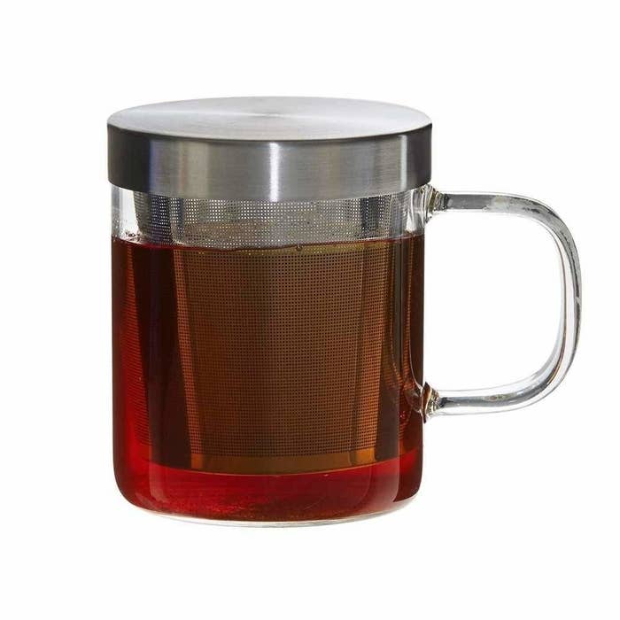 A grey tea infuser mug with tea in it