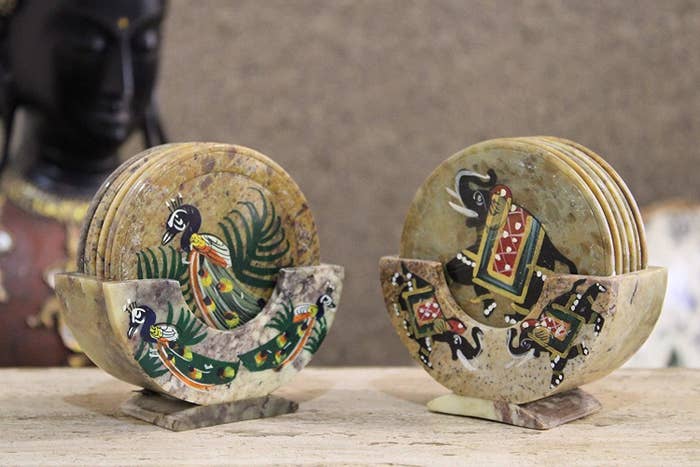 Marble coasters with peacocks on them