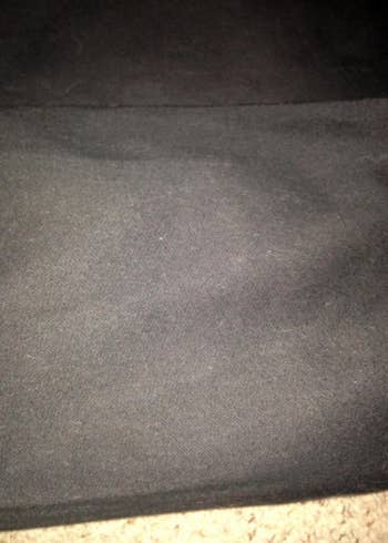 A dog bed without any dog hair on it, after being vacuumed 