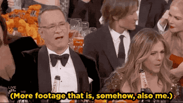 Tom Hanks looking confused at the Golden Globes with text reading &quot;(More footage that is, somehow, also me)&quot;