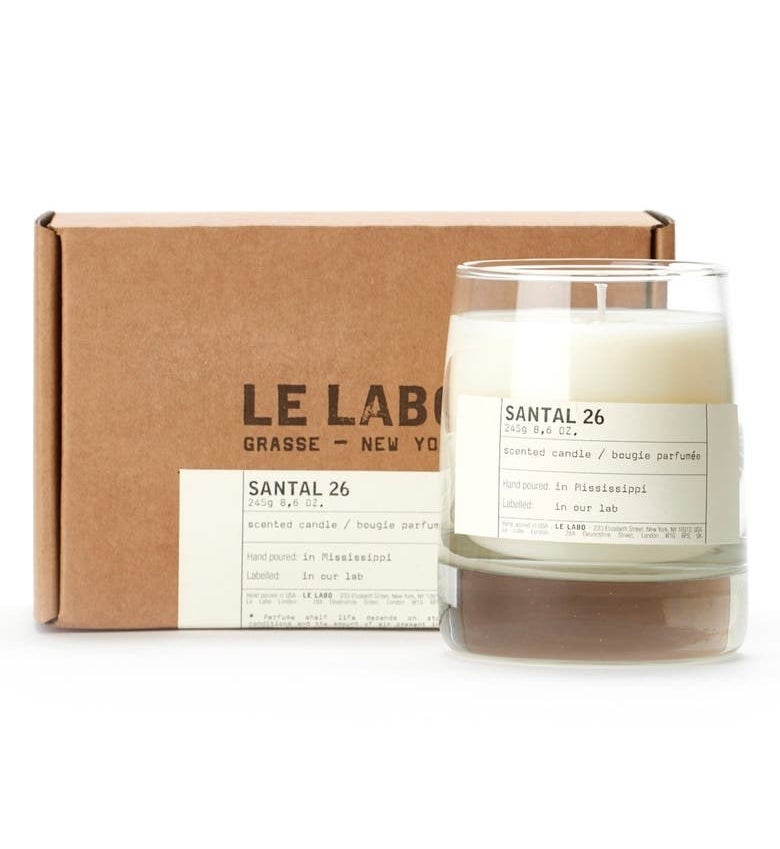 le labo santal 26 candle in glass votiv next to the box