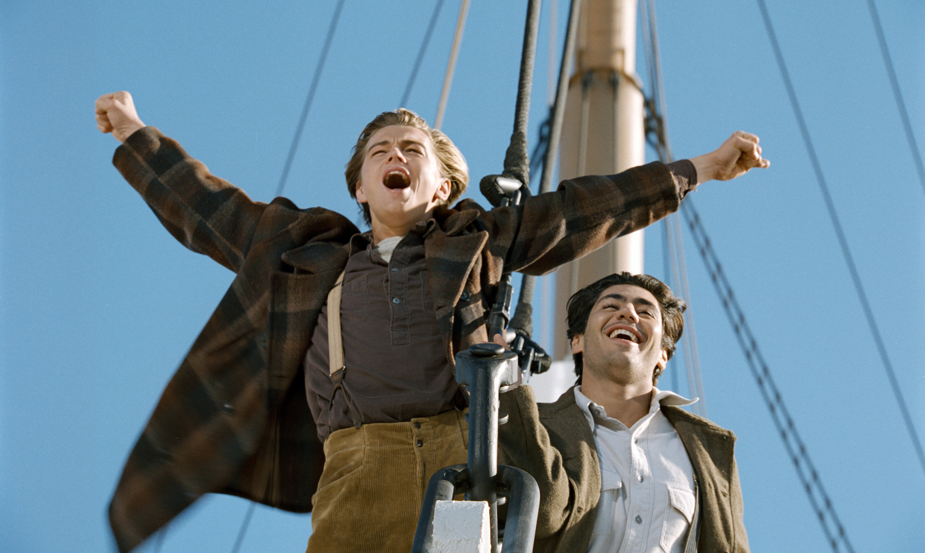 Leonardo DiCaprio doing his famous &quot;I&#x27;m the king of the world!&quot; pose alongside Danny Nucci in Titanic