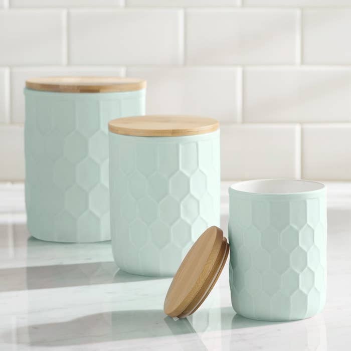 mint green kitchen containers with a honeycomb texture on the outside