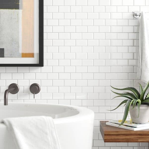 The white peel-and-stick tile in a bathroom
