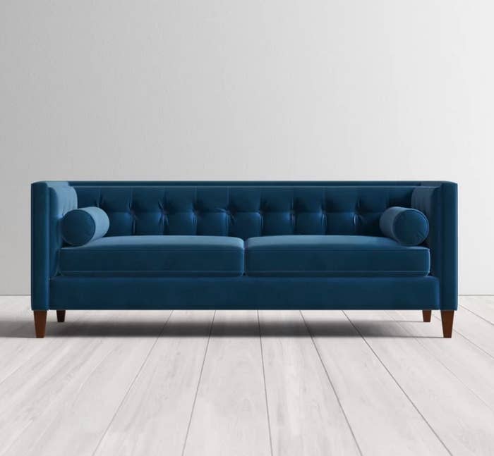 Dark blue velvet sofa