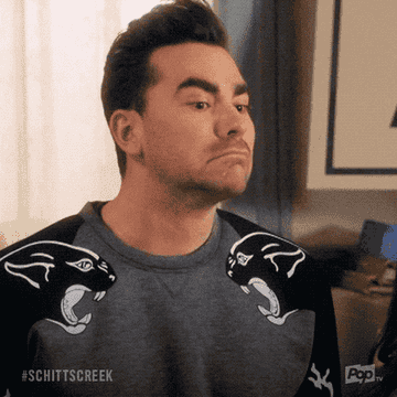 GIF of David from Schitt&#x27;s Creek saying wow and smiling