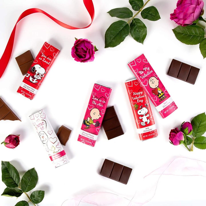 Assorted Peanuts-themed chocolate bars with roses