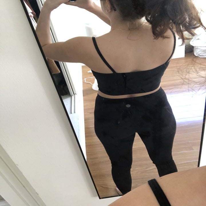 Daniella's backside in black leggings.