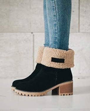 The black suede boot with the top turned over revealing the fleece insides