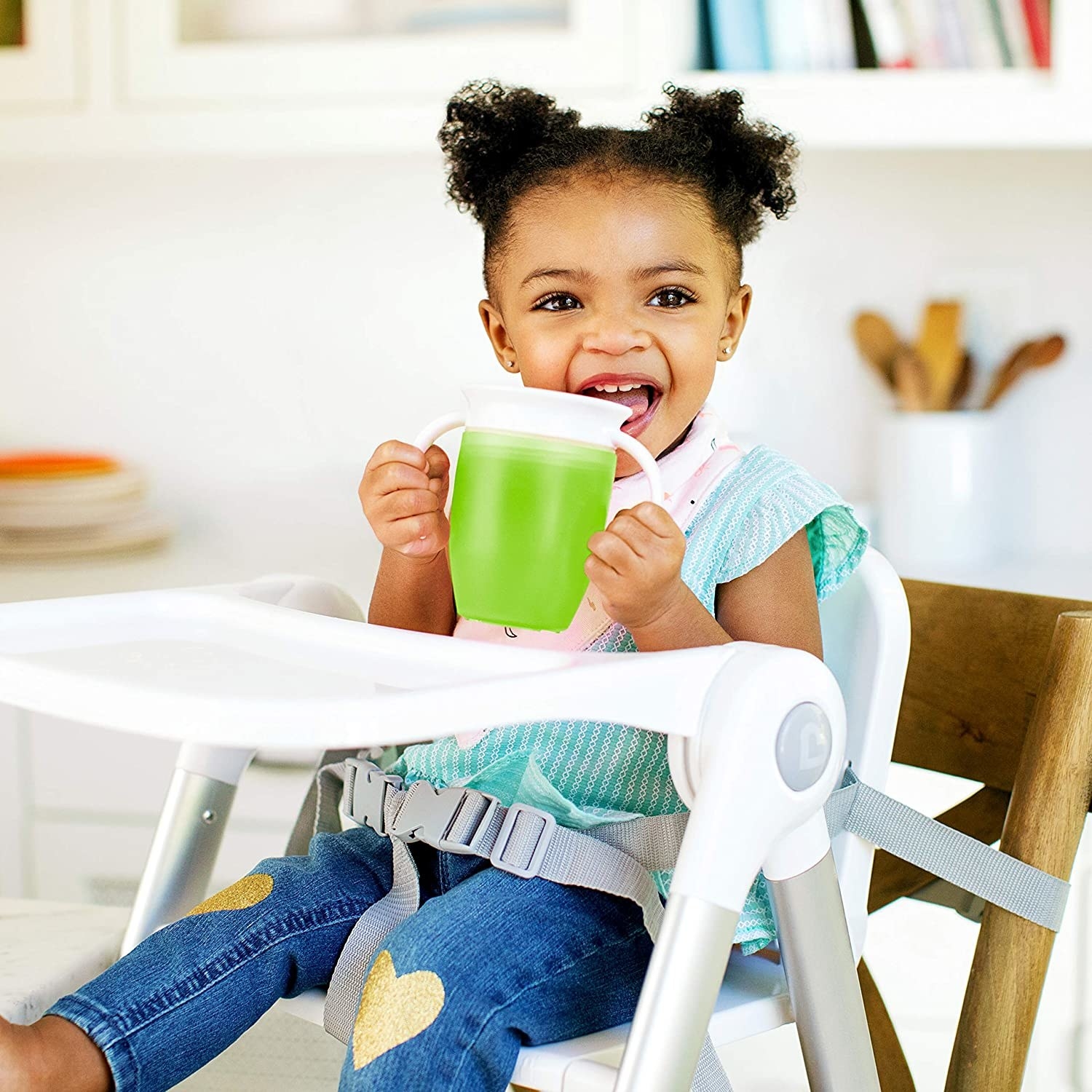 toddler drinking from the cup