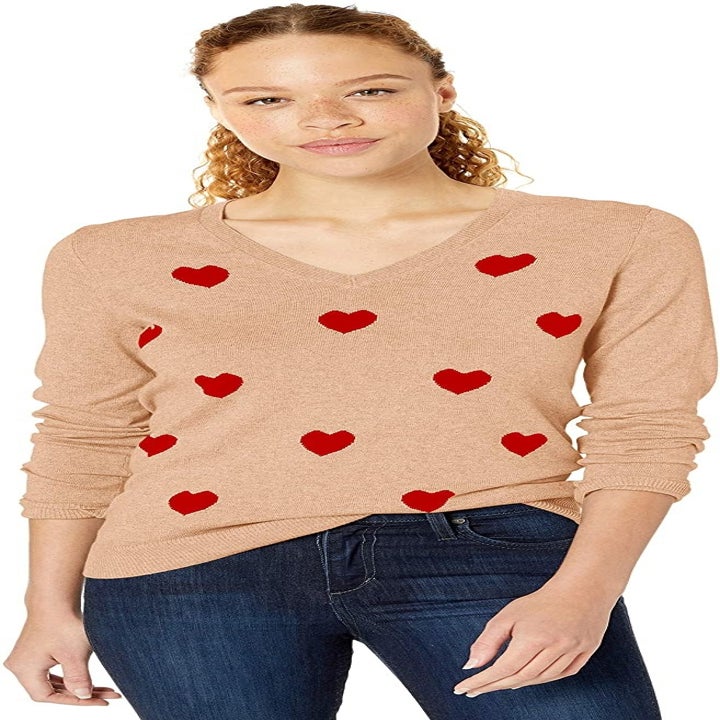 Model wearing the red heart sweater