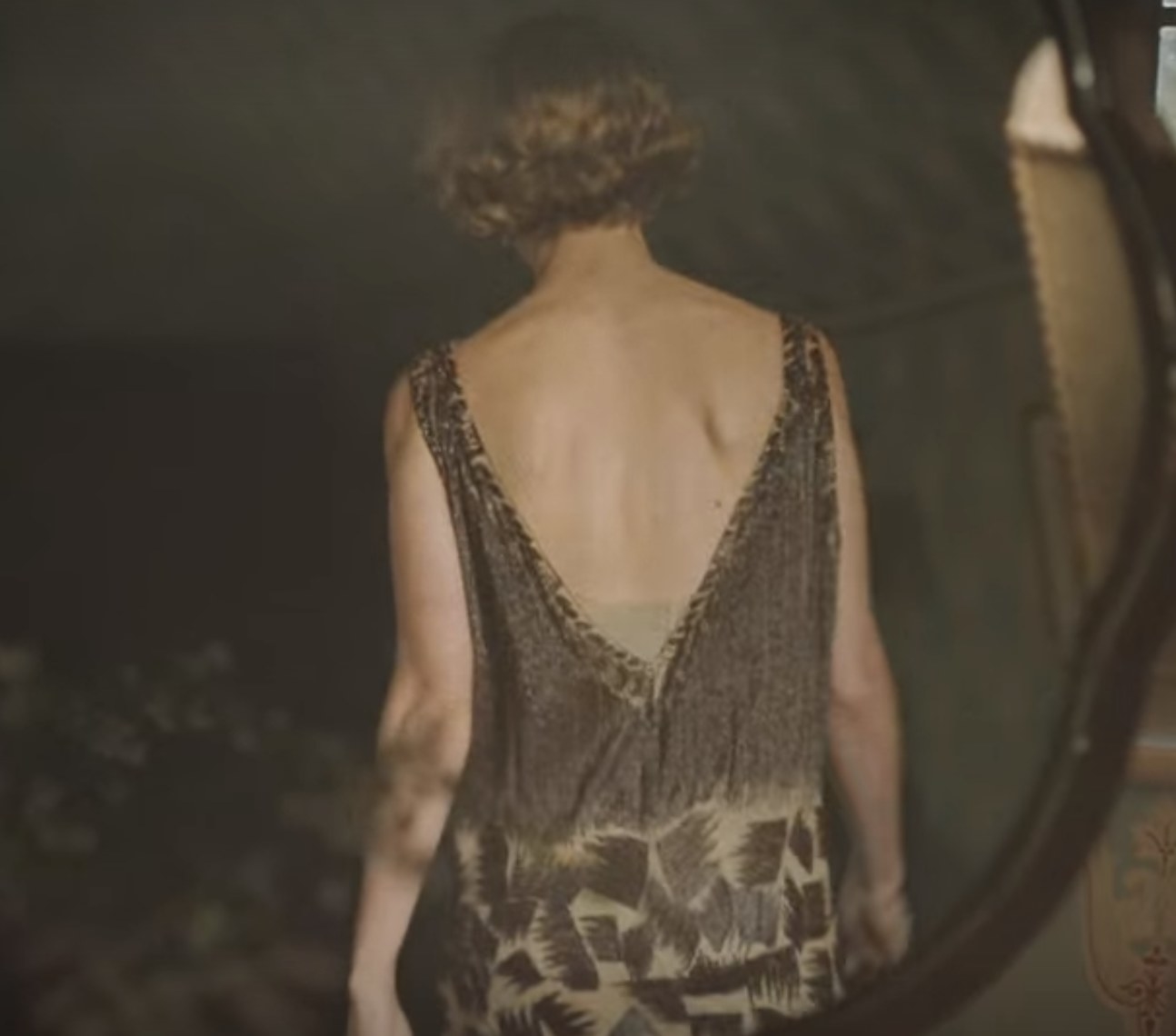 Still from The Dig: Back shot of Mrs. Pretty in gown