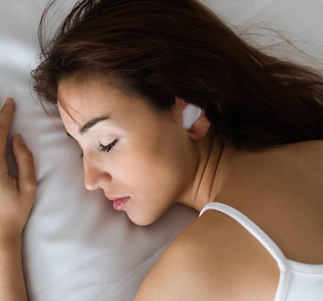 The earplugs worn by a sleeping model