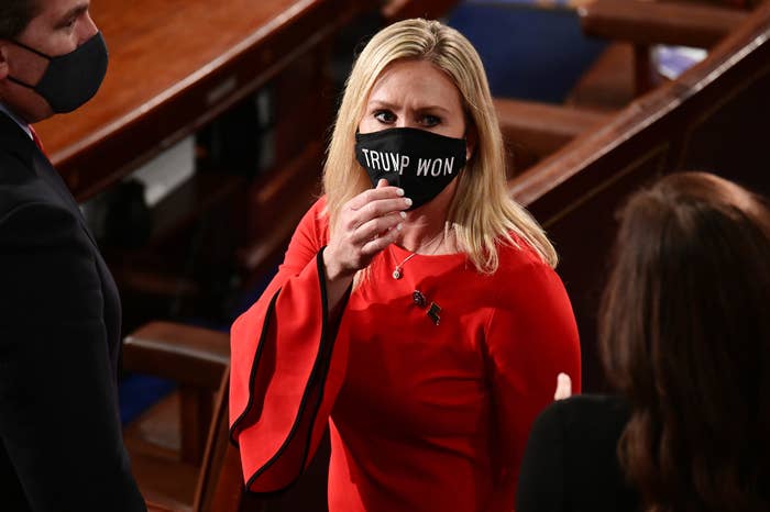 Rep. Marjorie Taylor Greene, R-Ga., wears a "Trump Won" face mask