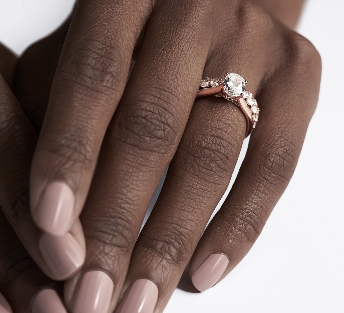 model wearing the diamond ring with rose gold band