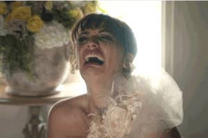 A bride in her wedding dress crying her eyes out
