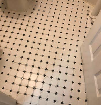 overall view of the same tile floor with the grout looking bright, white