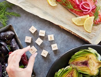 a person holding one of the dice