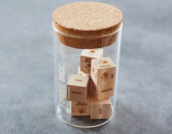 the wooden dice is a glass jar