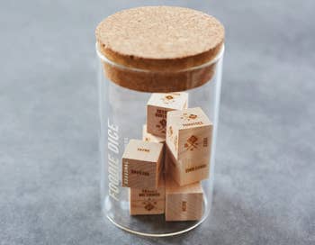 the wooden dice is a glass jar