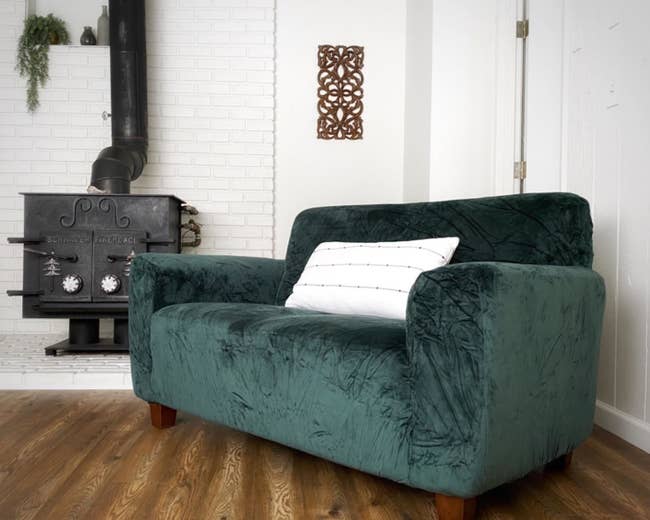 A reviewer's sofa with the dark green cover