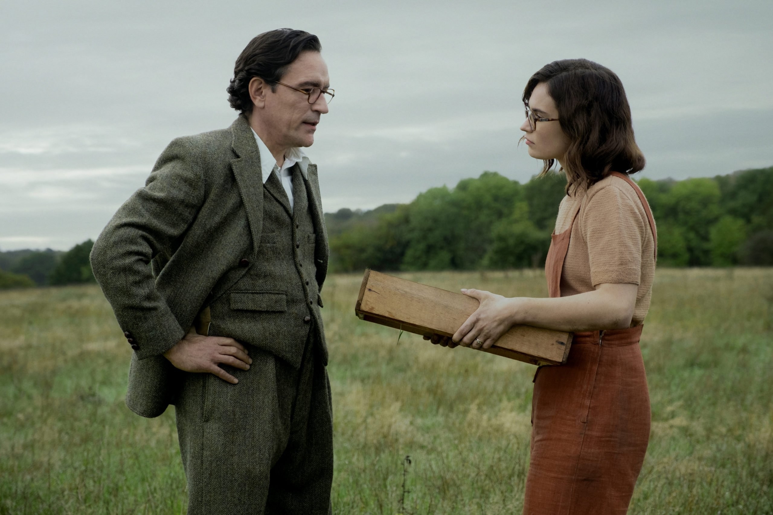 Still from The Dig: Peggy and husband in a field 