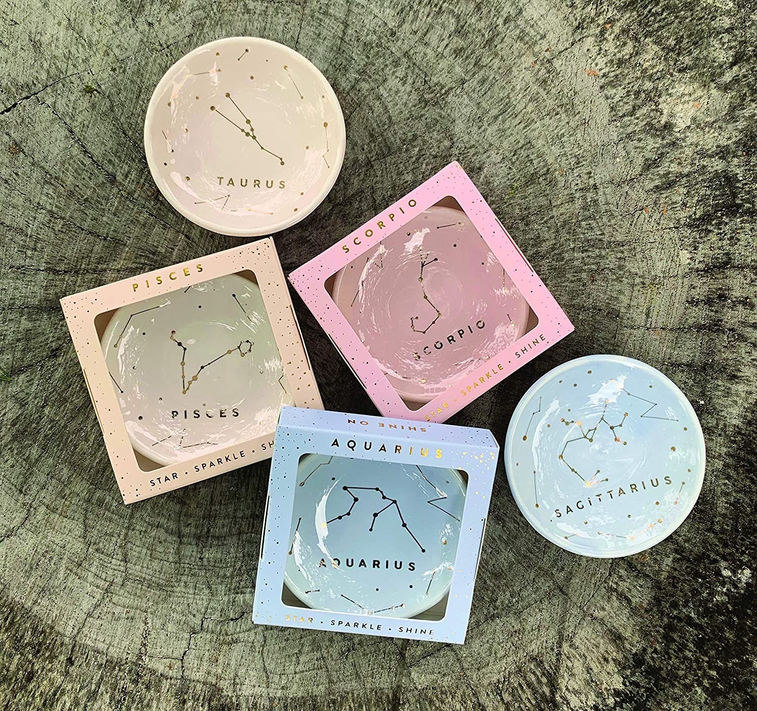 different zodiac-themed jewelry dishes