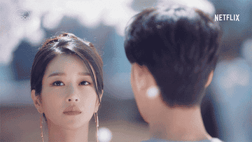 Kim Soo-hyun and Seo Yea-ji stare at each other as cherry blossoms fall around them