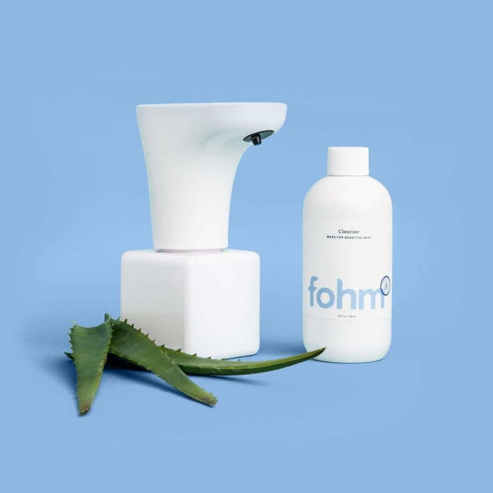 Fohm solution and dispenser against blue backdrop