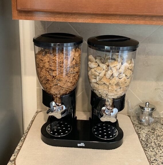 black cereal dispenser with cereal inside