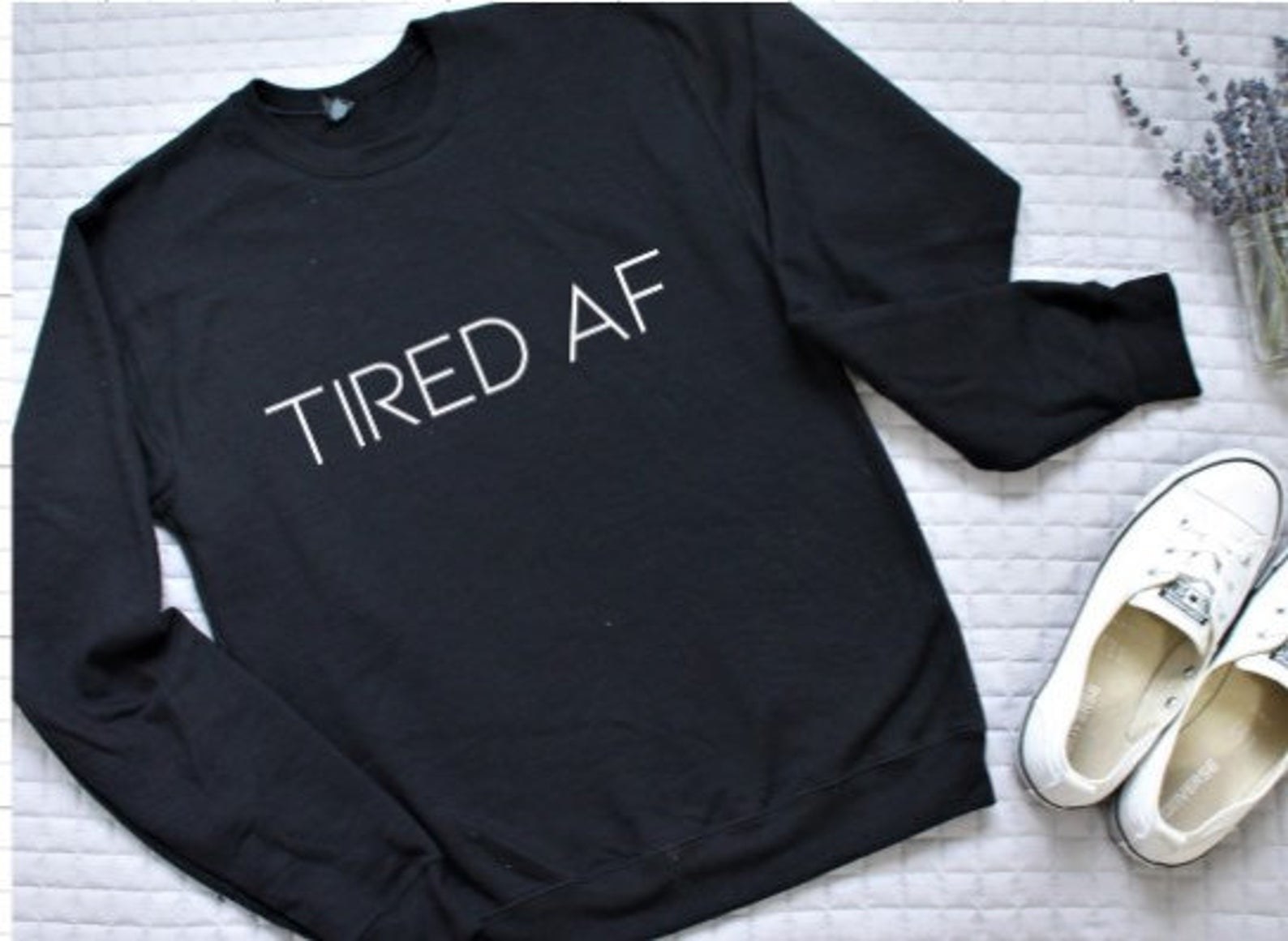 the sweatshirt that says tired AF
