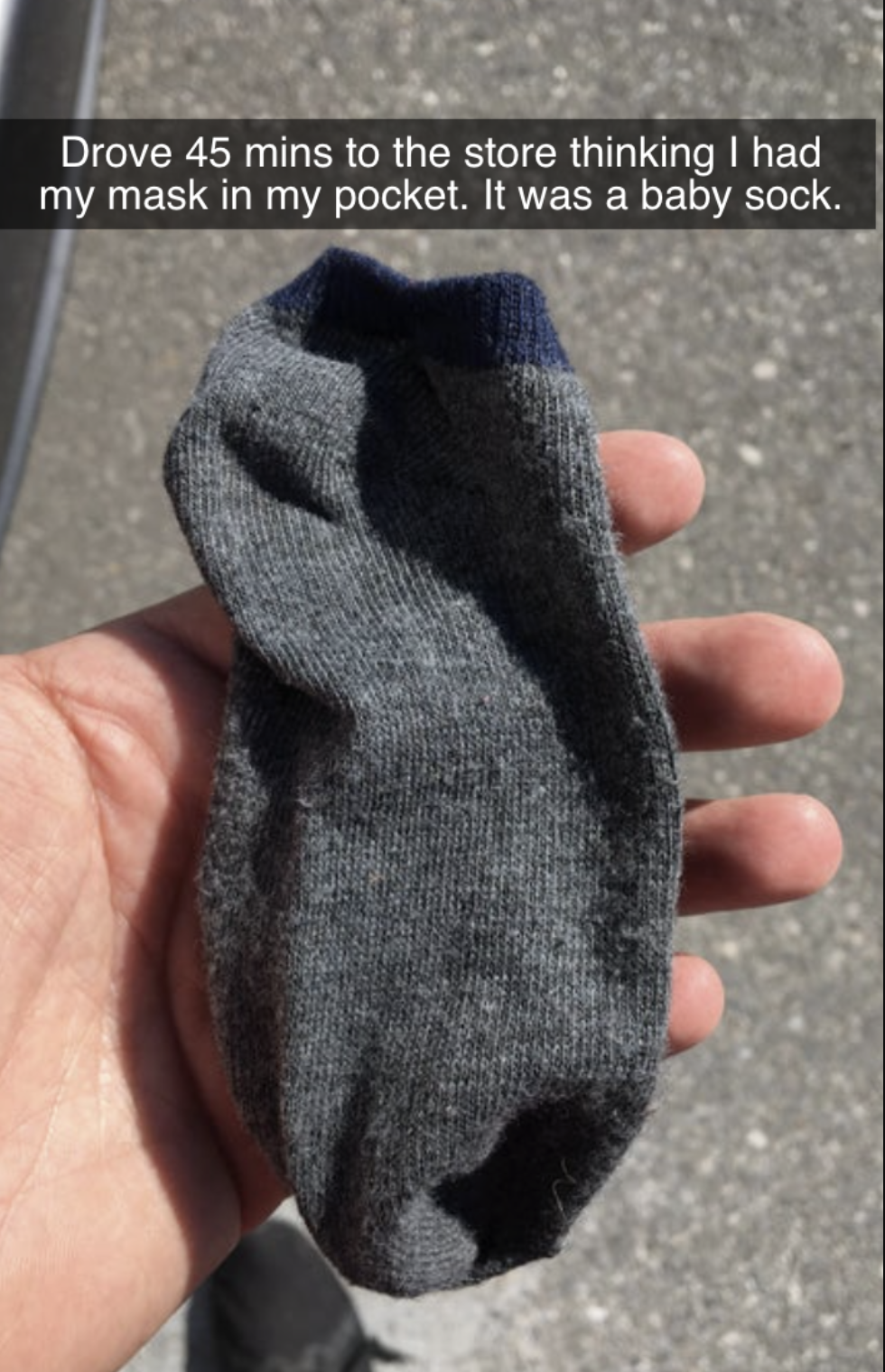 person who accidentally brought a baby sock to the store instead of a mask