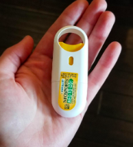 Reviewer holding the spray on applicator in their hand 