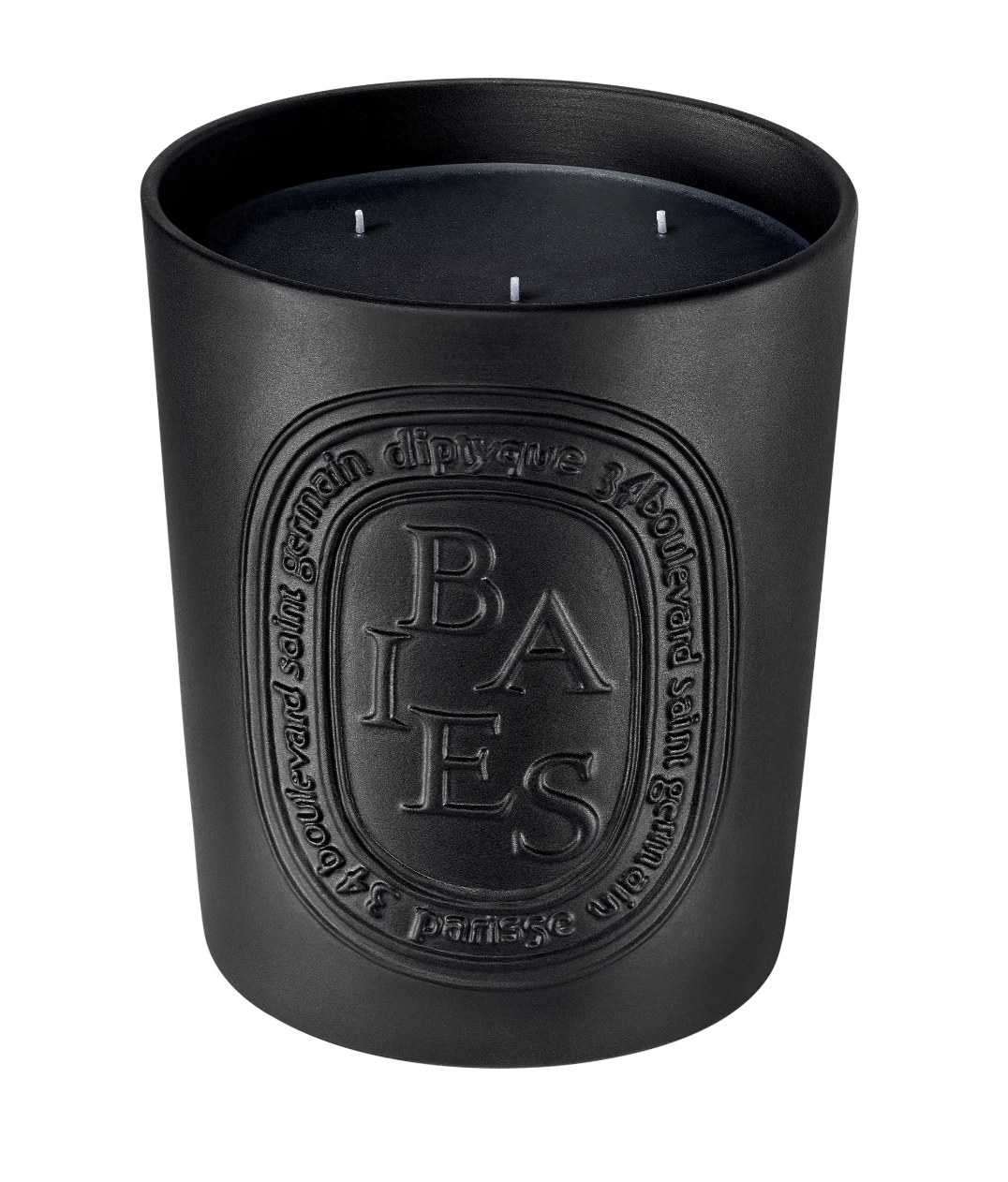 the candle encapsulated in a black porcelain vessel