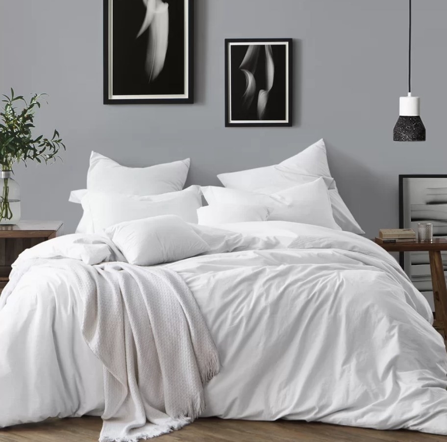 White duvet comforter on bed with matching pillows