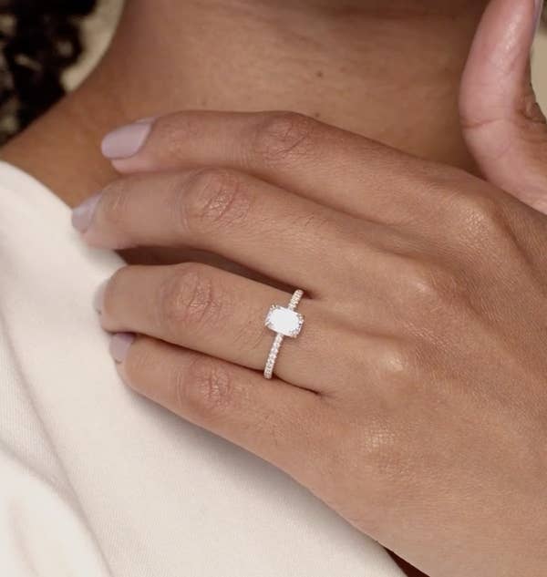 model wearing the emerald cut pave ring
