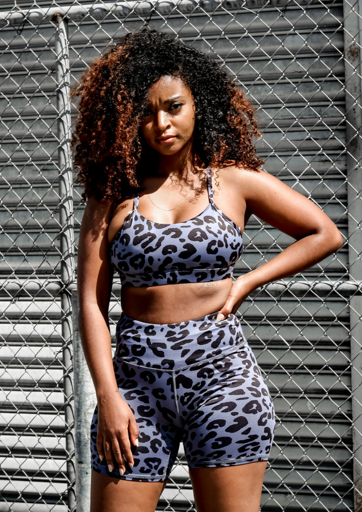 Model wearing the blue and black leopard set