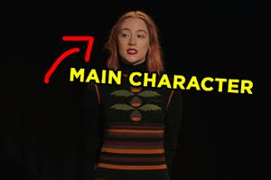 Saoirse Ronan standing on a stage as Lady Bird in "Lady Bird" with an arrow pointing to her and "main character" typed under her face