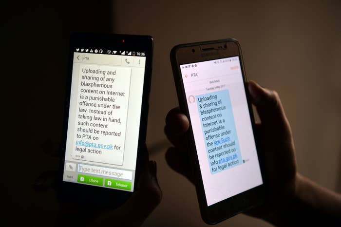 Text messages on two separate cellphones read &quot;uploading and sharing of any blasphemous content on internet is a punishable offense under the law,&quot; adding an email address to report such material