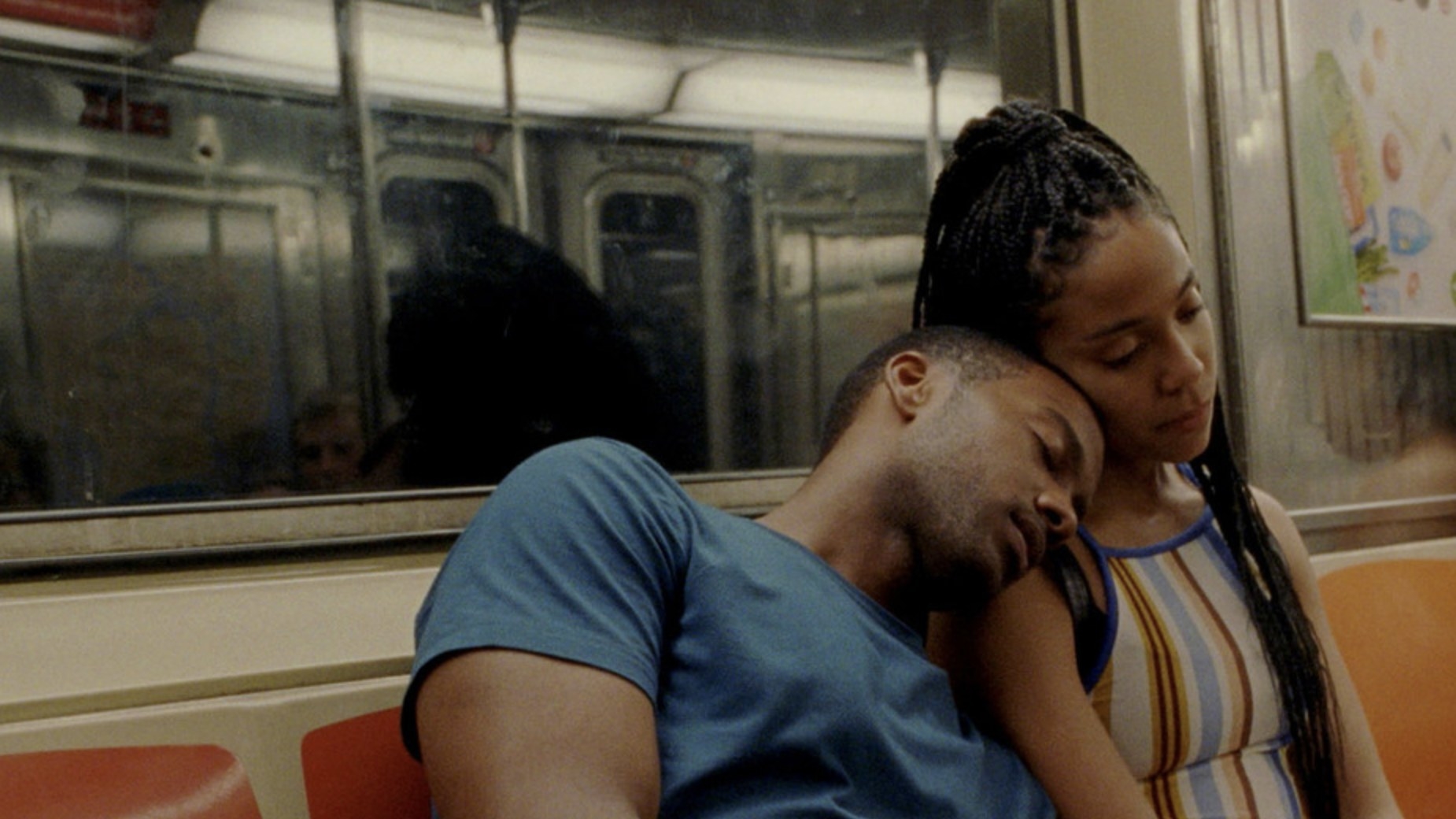 Ayanna and Isaiah sitting on the subway together