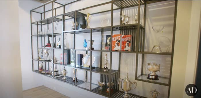 A shelf lined with trophies in Serena Williams' trophy room in her Miami home