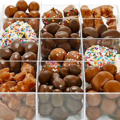 Clear acrylic case filled with 12 different types of chocolate candies