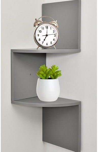 The shelf, which is gray and has two horizontal shelf surfaces that are connected by vertical pieces