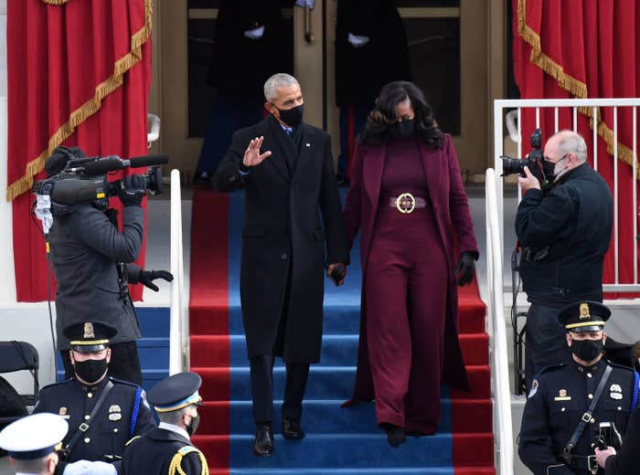 Barack Obama, waving to the crowd, and Michelle Obama descend stars at President Joe Biden&#x27;s inauguration