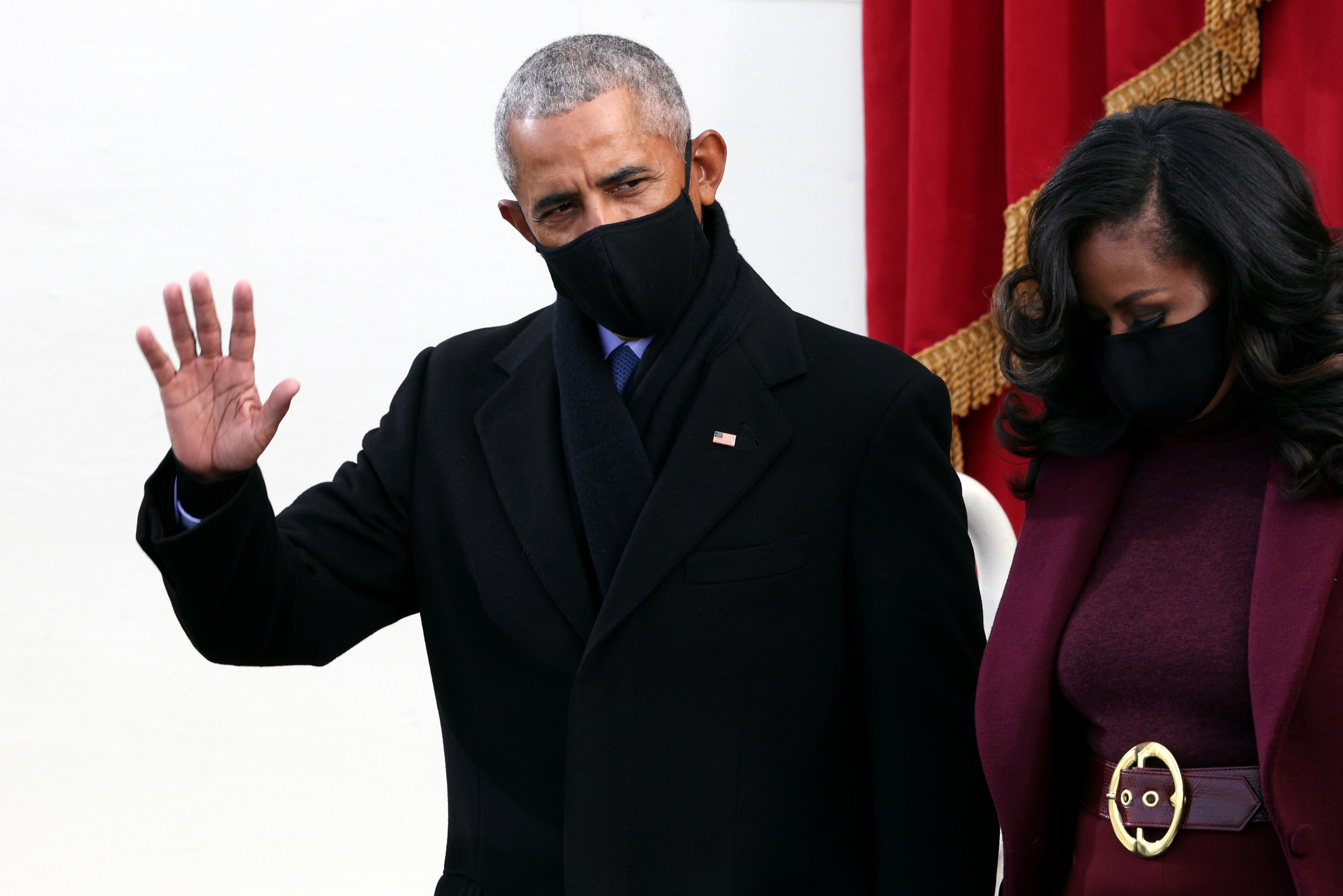 Barack Obama waves to the crowd alongside Michelle at President Joe Biden&#x27;s inauguration