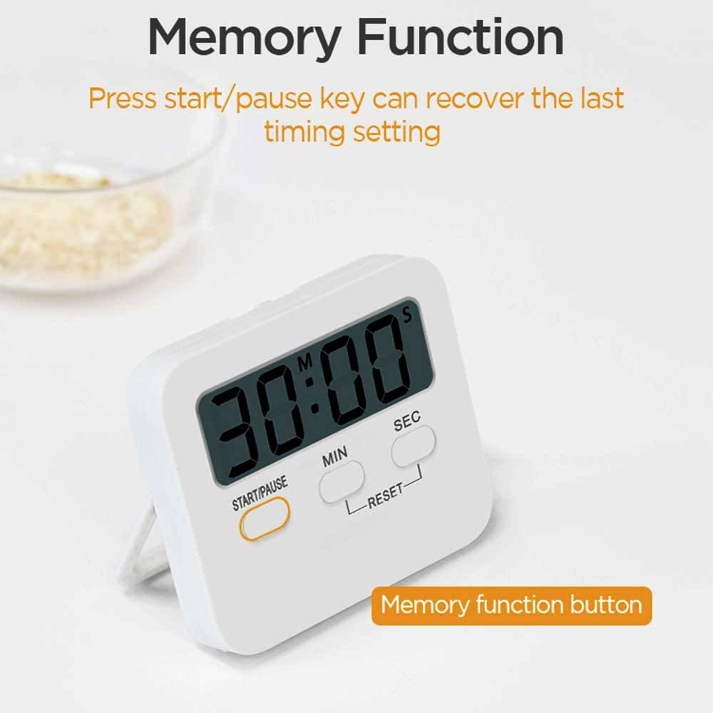 A white digital timer on a table 