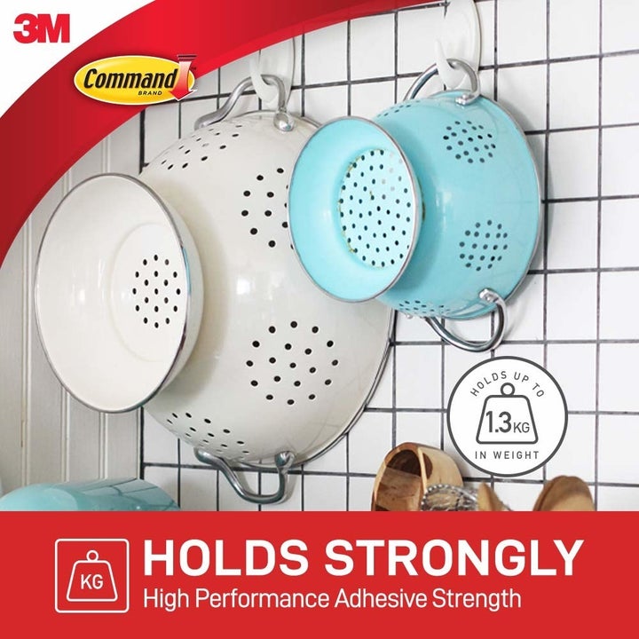 A set of pots hung up with Command hooks