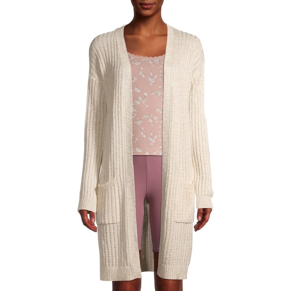 Model in long cardigan with pockets