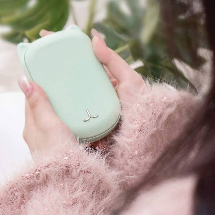 mint hand warmer with cat ears 