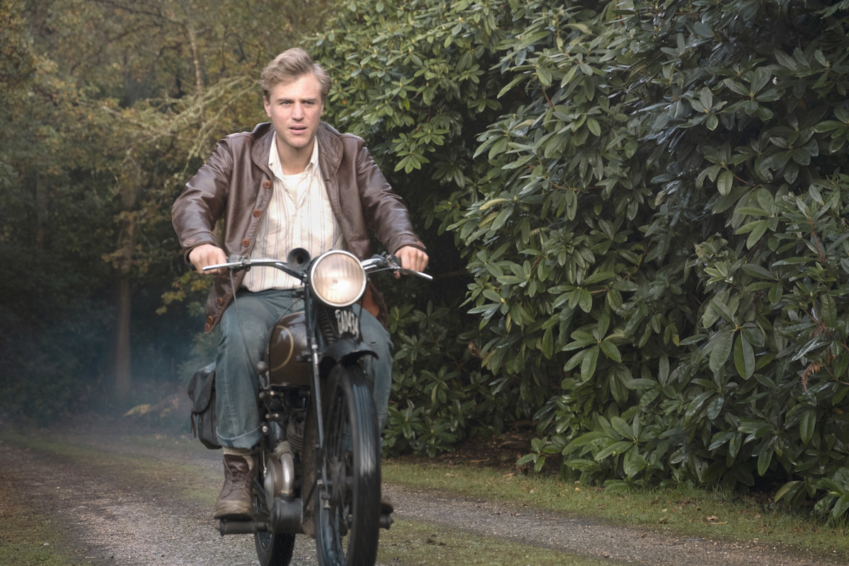 Still from The Dig: Rory Lomax on a motorcycle